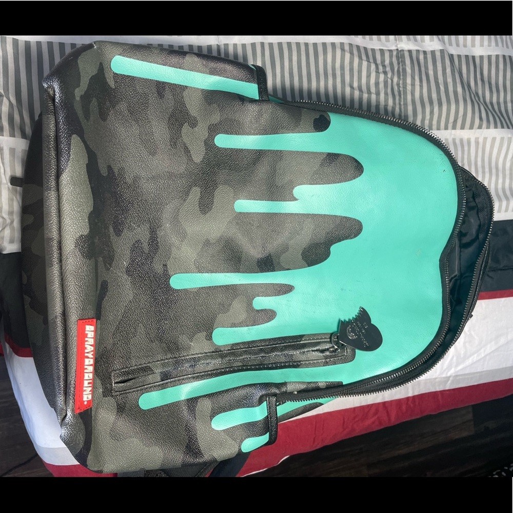 Sprayground backpack dripping paint